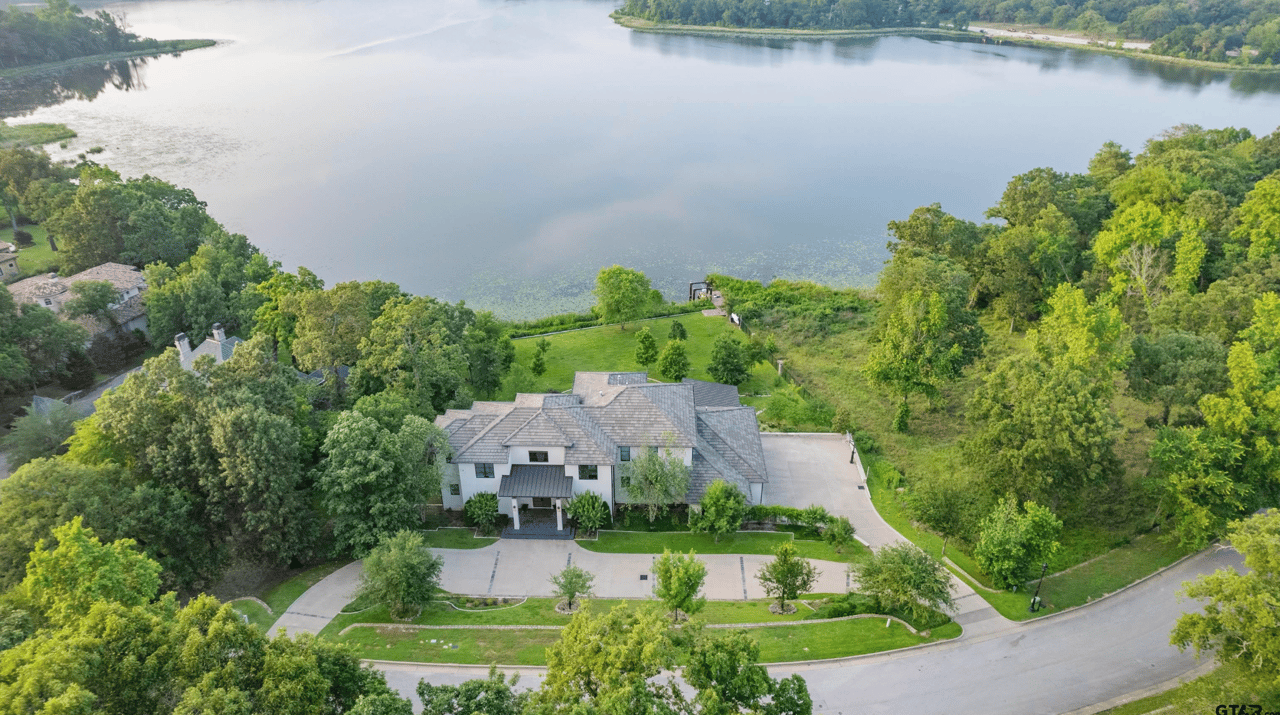 Luxury aeriel shot of house on lake