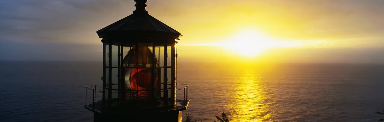 Bright Sunset flare behind the Cape Meares Lighthouse