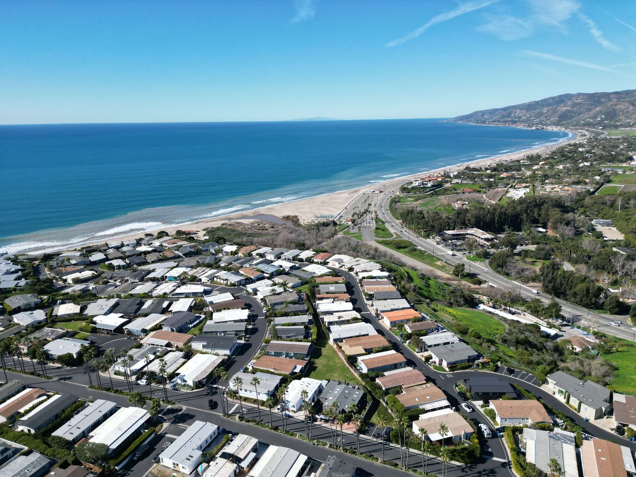 Located above the blue Pacific Ocean is the Point Dume Mobile Home Park in Malibu California. 