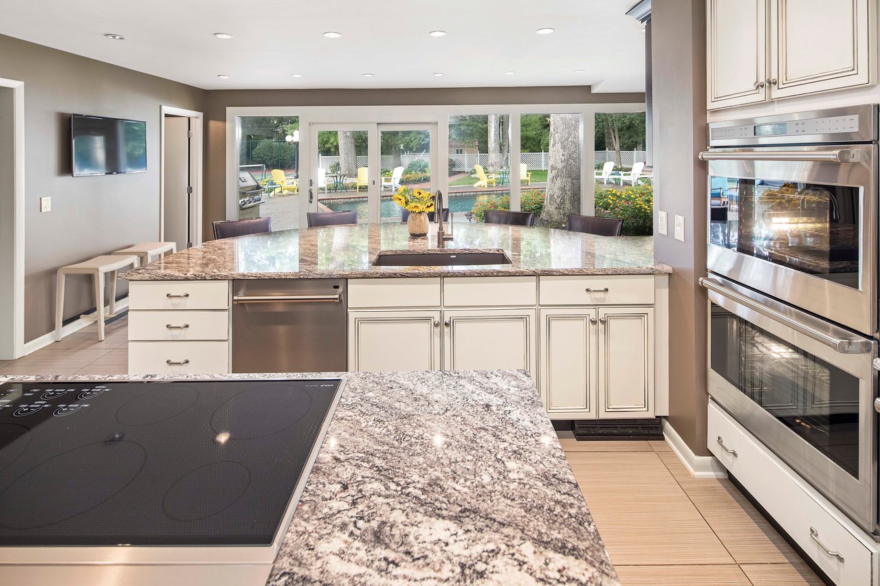 A Special Retreat on a Prized One Acre Lot With Pool and Tennis Court