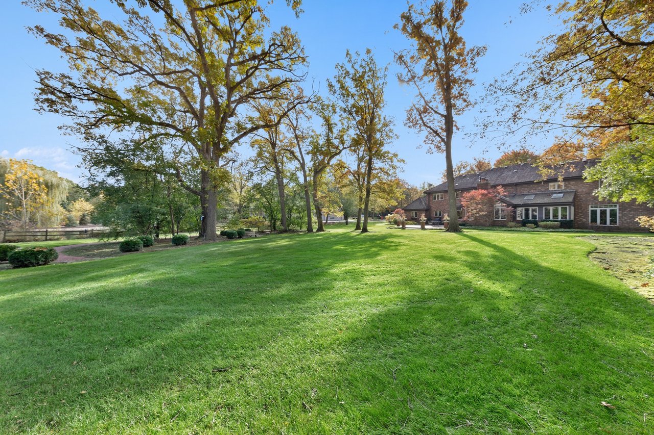 Beautifully Appointed Home in a Gated Community on Over an Acre of Professionally Landscaped Grounds with Pond Views