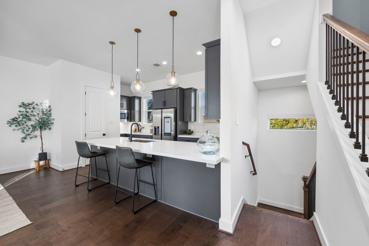 kitchen and stairway in an Eastwood Estates home 