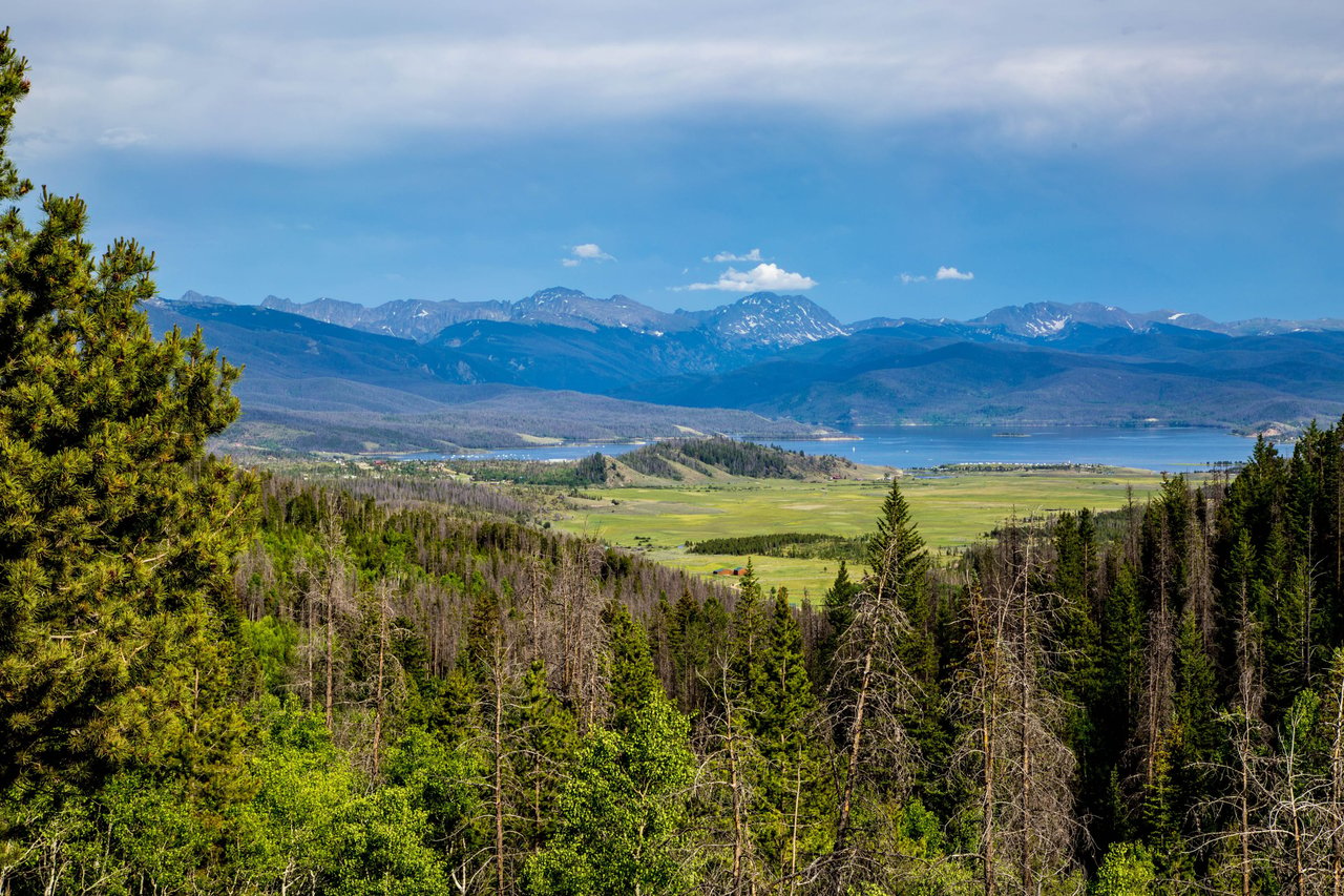 A beautiful valley nestled among snow-capped mountains