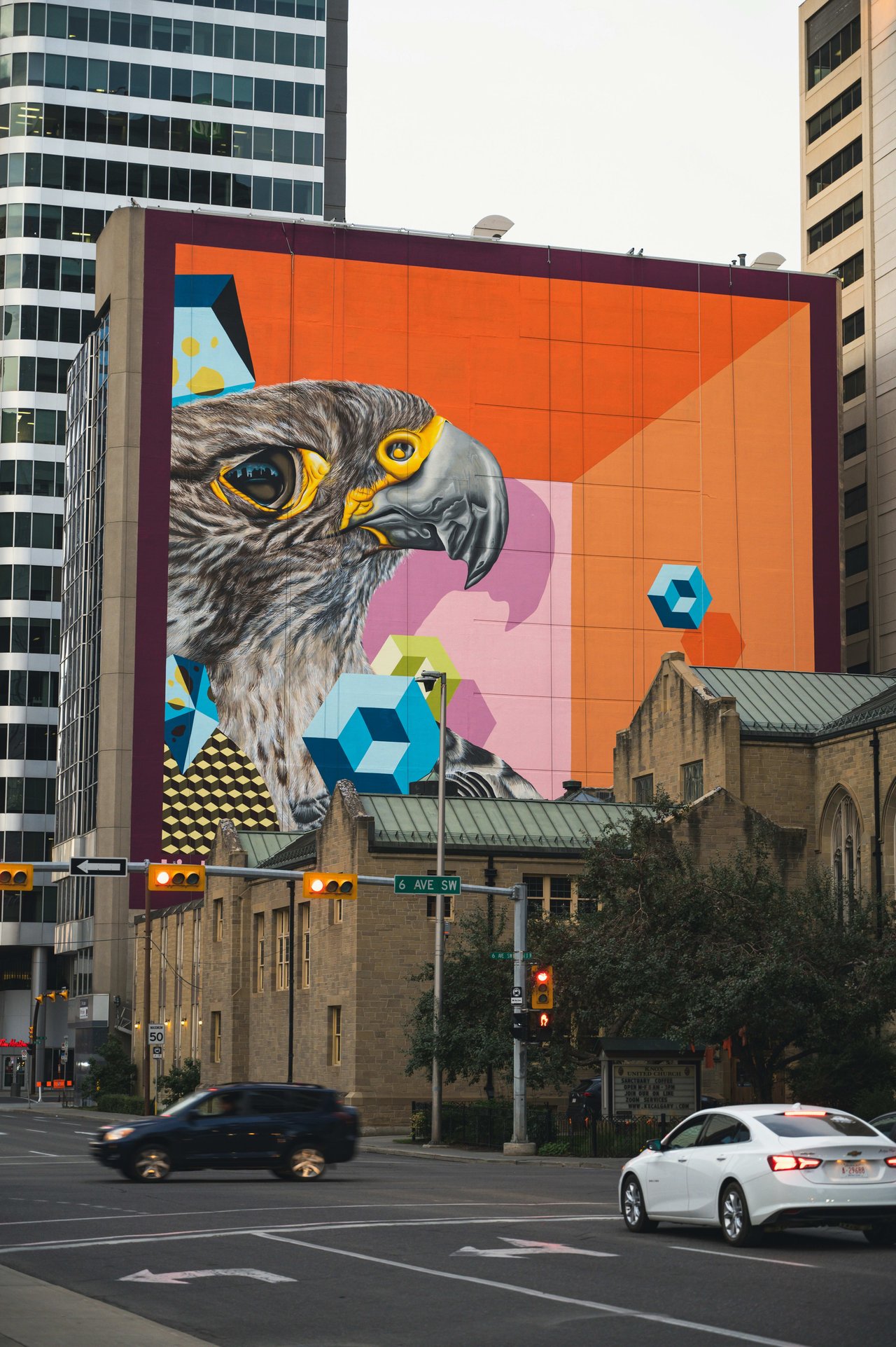 Bright and vibrant mural on the exterior of a building downtown Calgary by 6 avenue SW 