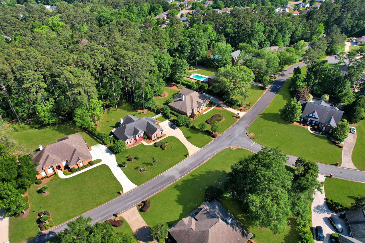 Aerial view of Golden Eagle showcasing several residential properties and their surroundings. 