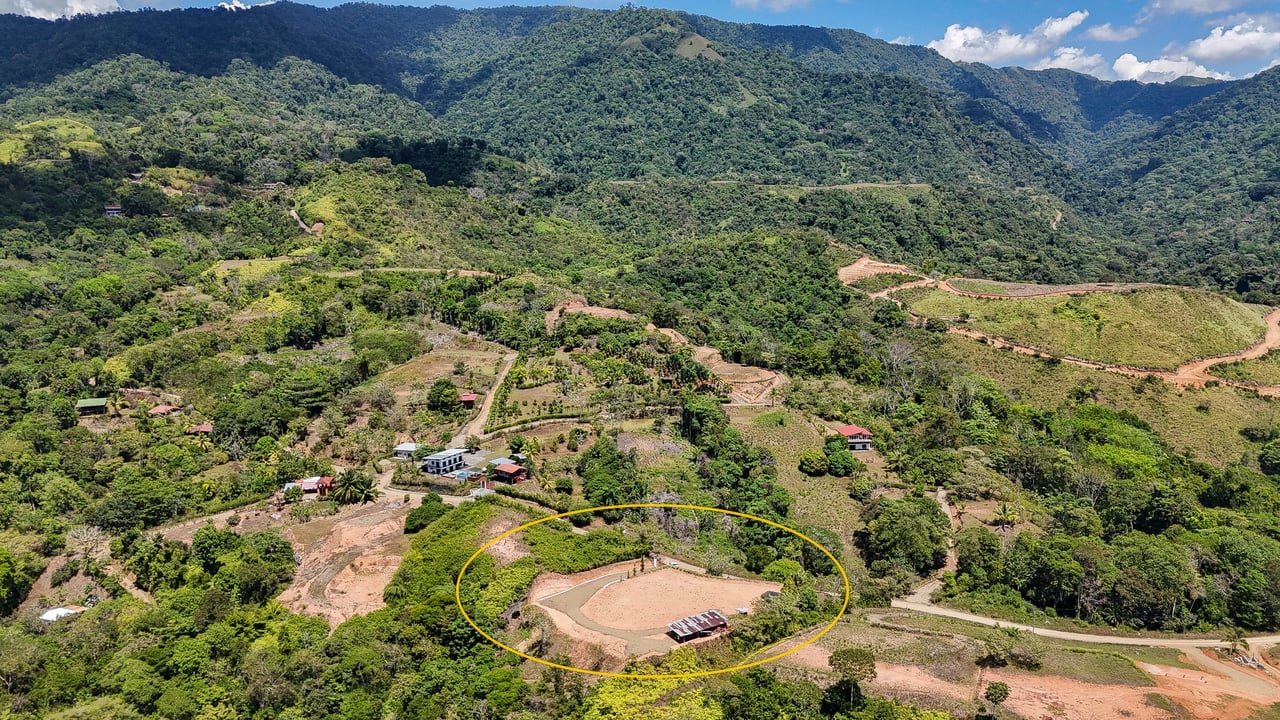 An elevated, prepared river lot with 360-degree ocean, mountain, valley and jungle views