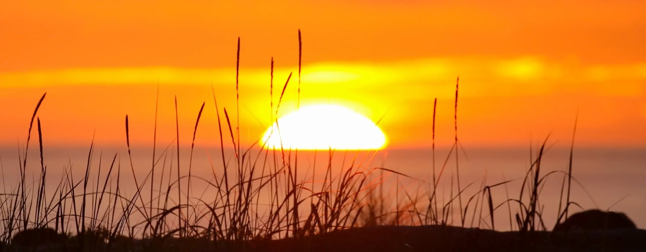 Bright Orange sunset over the Pacific ocean in Netarts Oregon