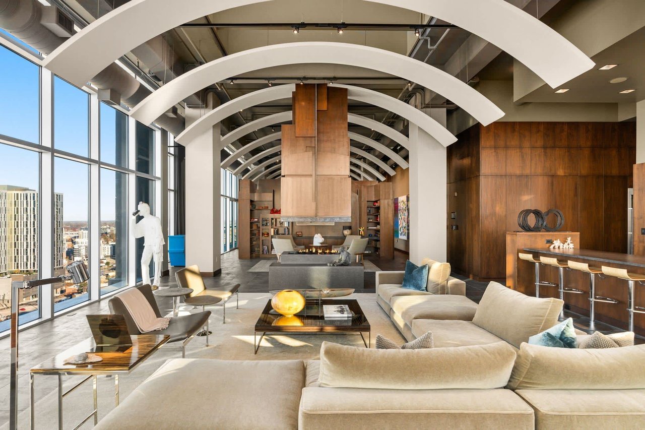 Spacious Icon in the Gulch Nashville penthouse with floor-to-ceiling windows, city views, and modern high-end finishes.