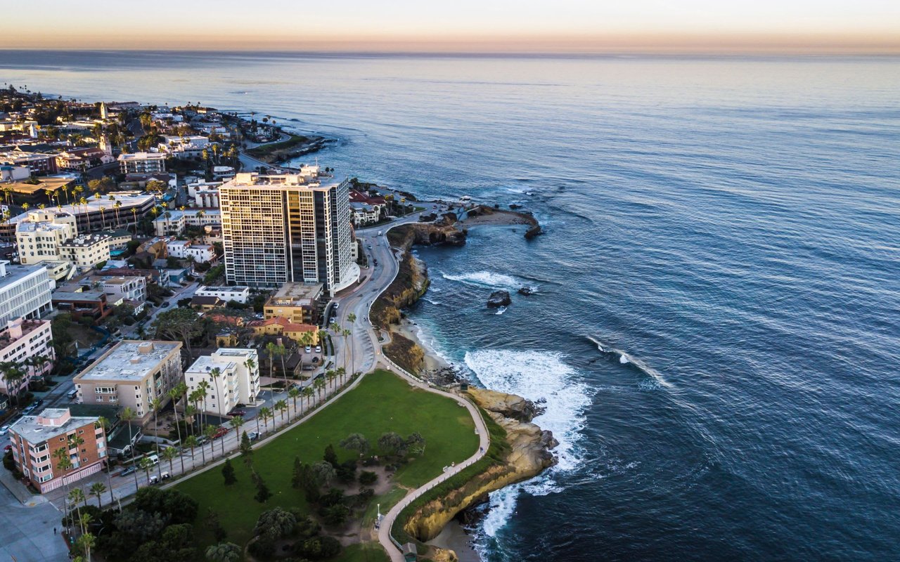 Aerial view of La Jolla coastline and cliffs with waves crashing