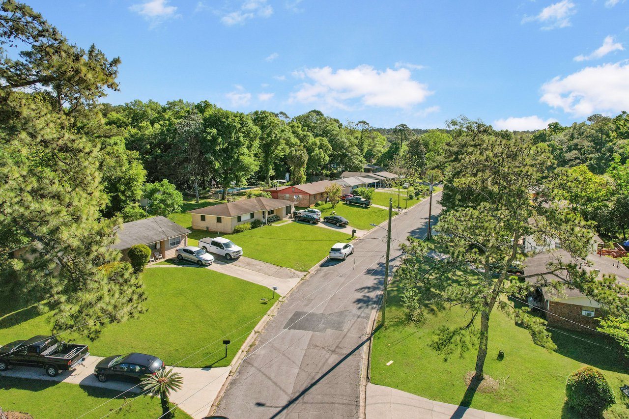 Another aerial view of the Beacon Hill neighborhood, featuring houses, streets, and significant greenery.