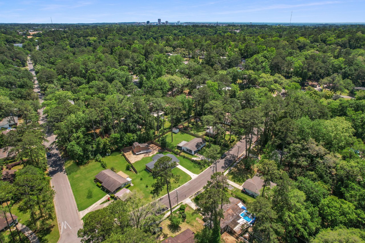 A broader aerial view of the Town and Country community, showing the extensive green spaces and residential layout.