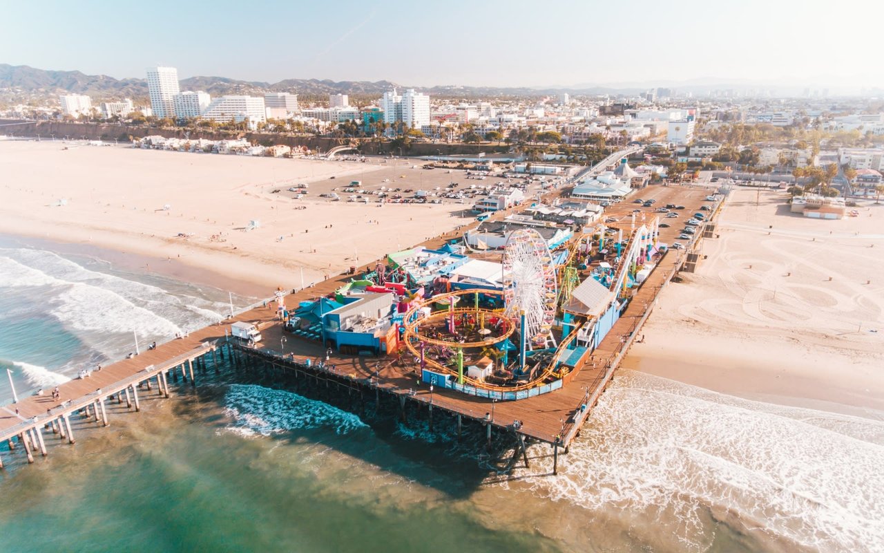 An aerial view of a pier and amusement park