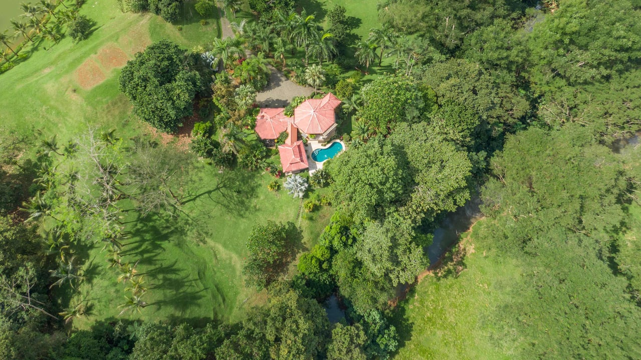 Stunning Tropical Home in Gated community with Hundreds of fruit trees  