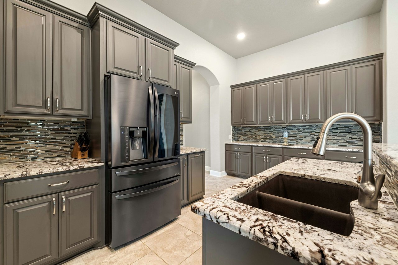 Impeccably Maintained 1-Story Taylor Morrison Home with Luxurious Amenities in Desirable Travisso Neighborhood!