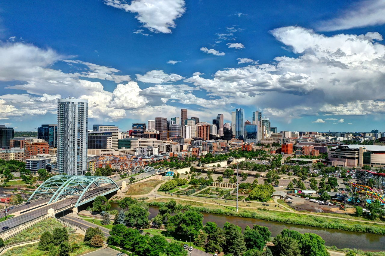 An aerial view of Denver showcasing the city's skyline and the Platte River