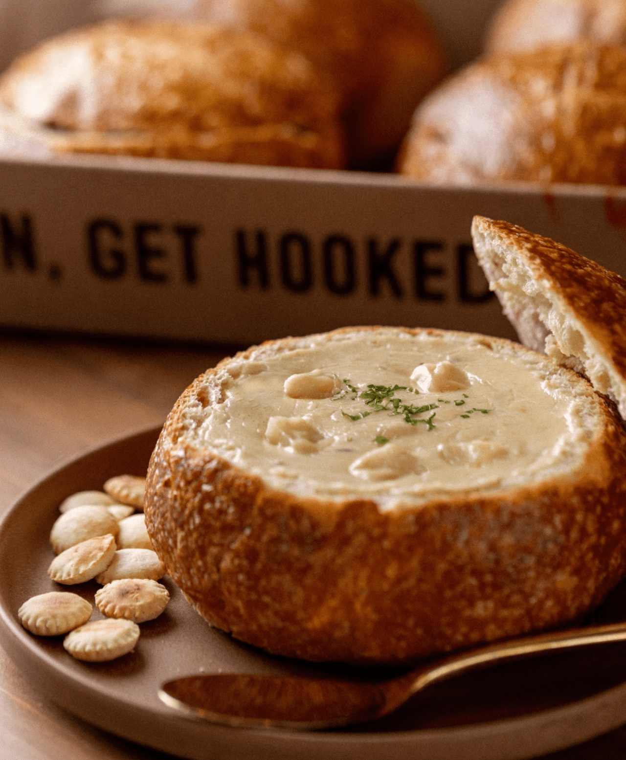 The clam chowder at Bluewater Grill is rich, creamy, and loaded with tender clams and hearty potatoes. It has a perfect balance of savory flavors, served with fresh bread for dipping, making it a comforting and satisfying choice.