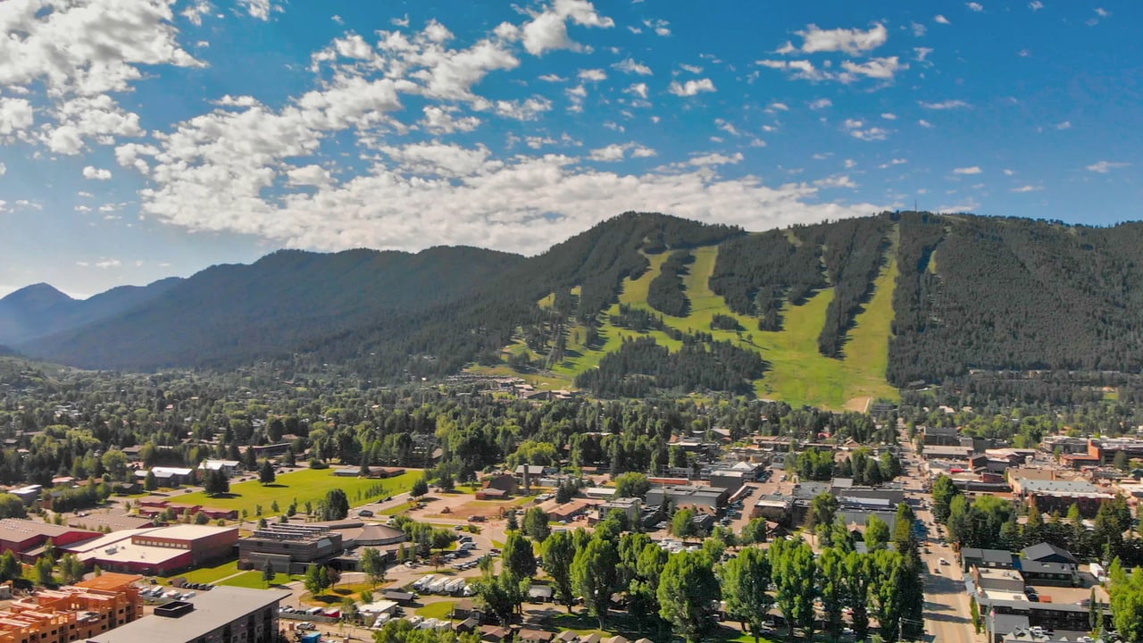 Aerial view of affordable neighborhoods in Jackson, WY, highlighting scenic landscapes and residential homes, ideal for budget-conscious home buyers in Jackson Hole.