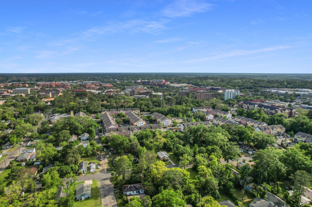 An aerial view of the Frenchtown community, showcasing the layout of houses, streets, and green areas.