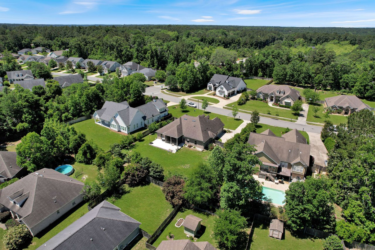 An aerial view of the Bull Run neighborhood, highlighting houses, lawns, and trees.