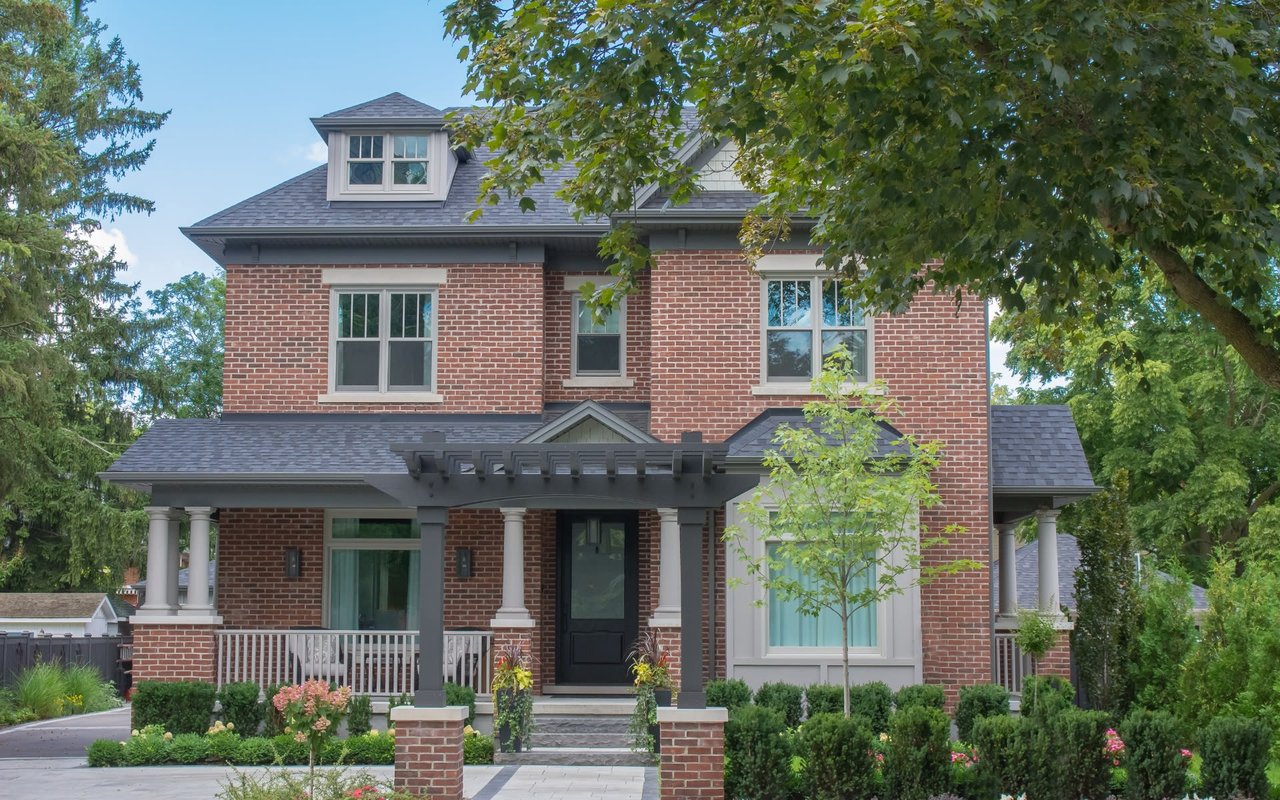 A welcoming brick house with a classic porch.