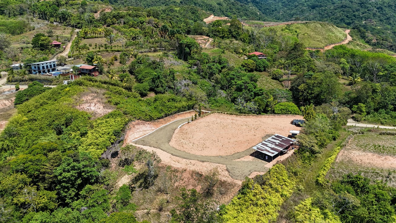 An elevated, prepared river lot with 360-degree ocean, mountain, valley and jungle views