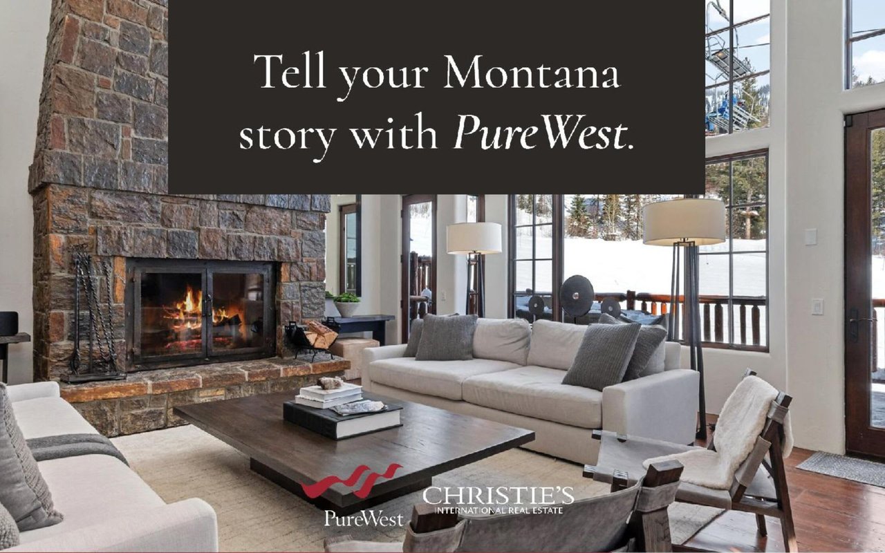  A cozy and rustic living room with a prominent stone fireplace, featuring a roaring fire within