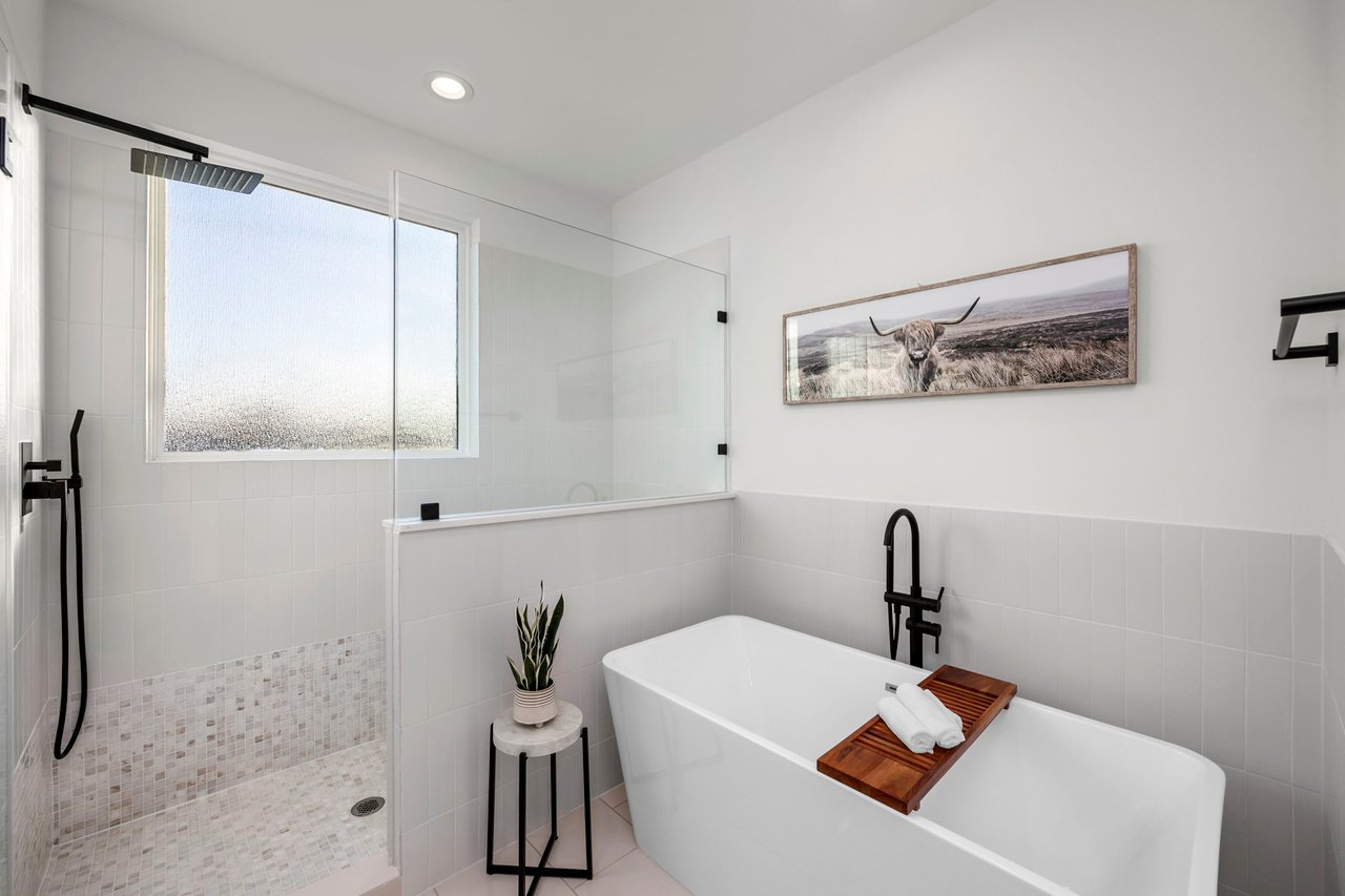 master bathroom with a large tub