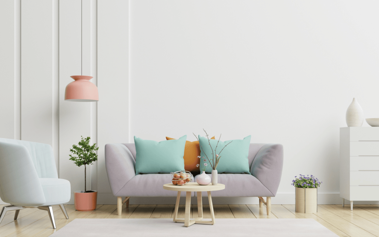 A living room with a pastel-colored chair and a couch facing a wooden coffee table.