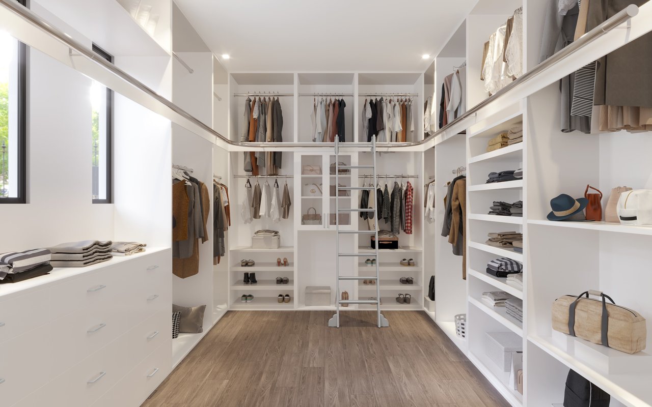 Luxurious walk-in closet with a sliding ladder, built-in shelves, and ample storage space in a stylish Dallas home.