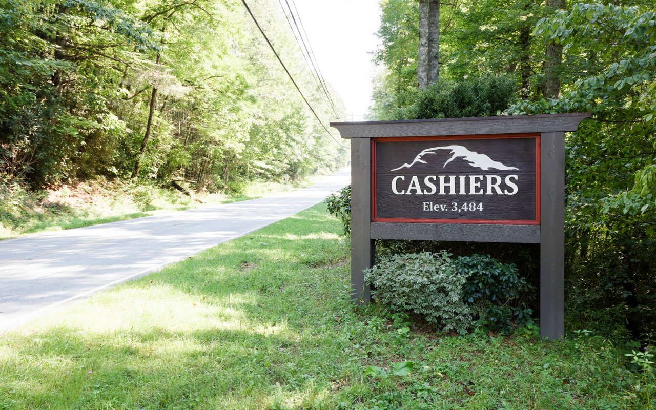 A sign as you enter Cashiers North Carolina showing elevation of 3484 feet