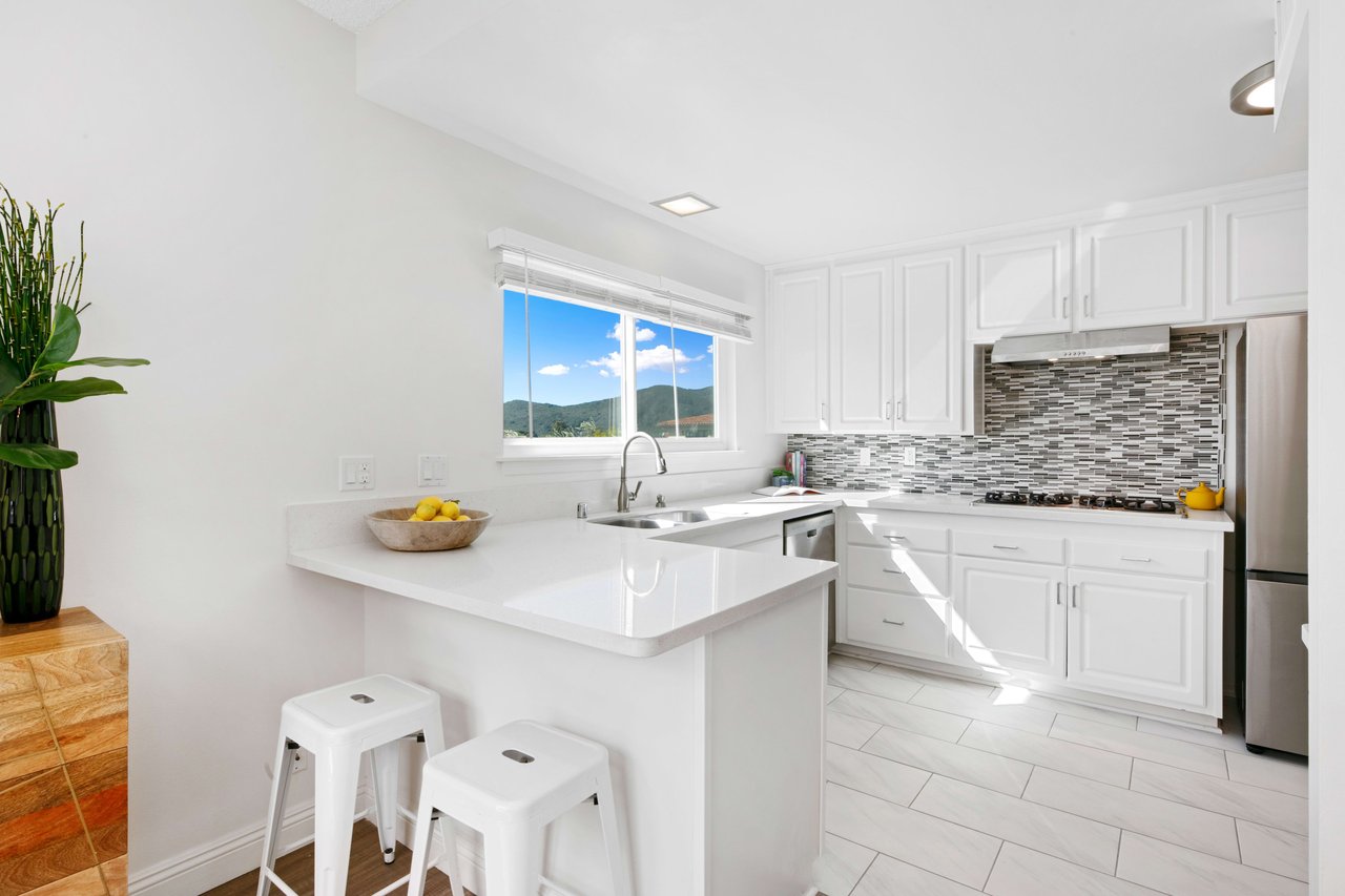 Kitchen with quartz counters and stainless steel appliances