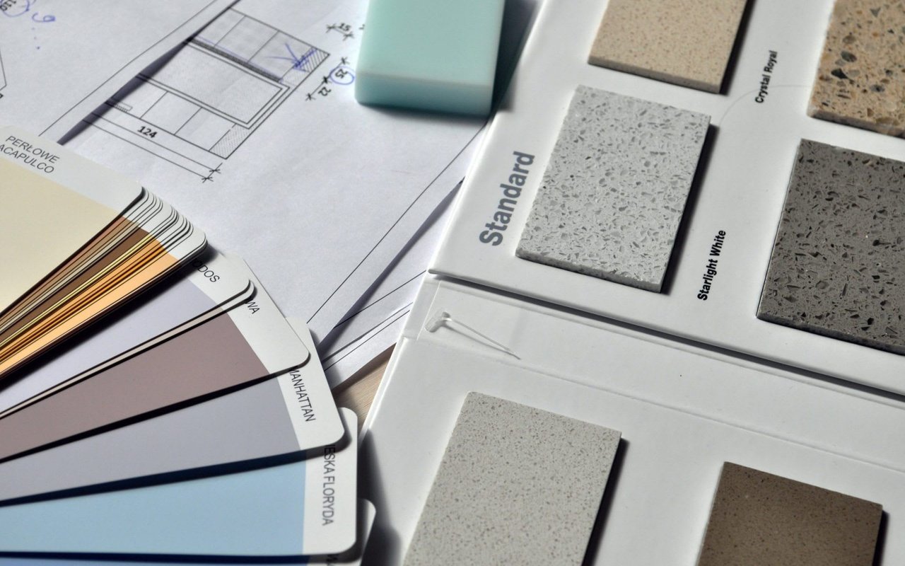  A close-up overhead view displays various materials for interior design and renovation.