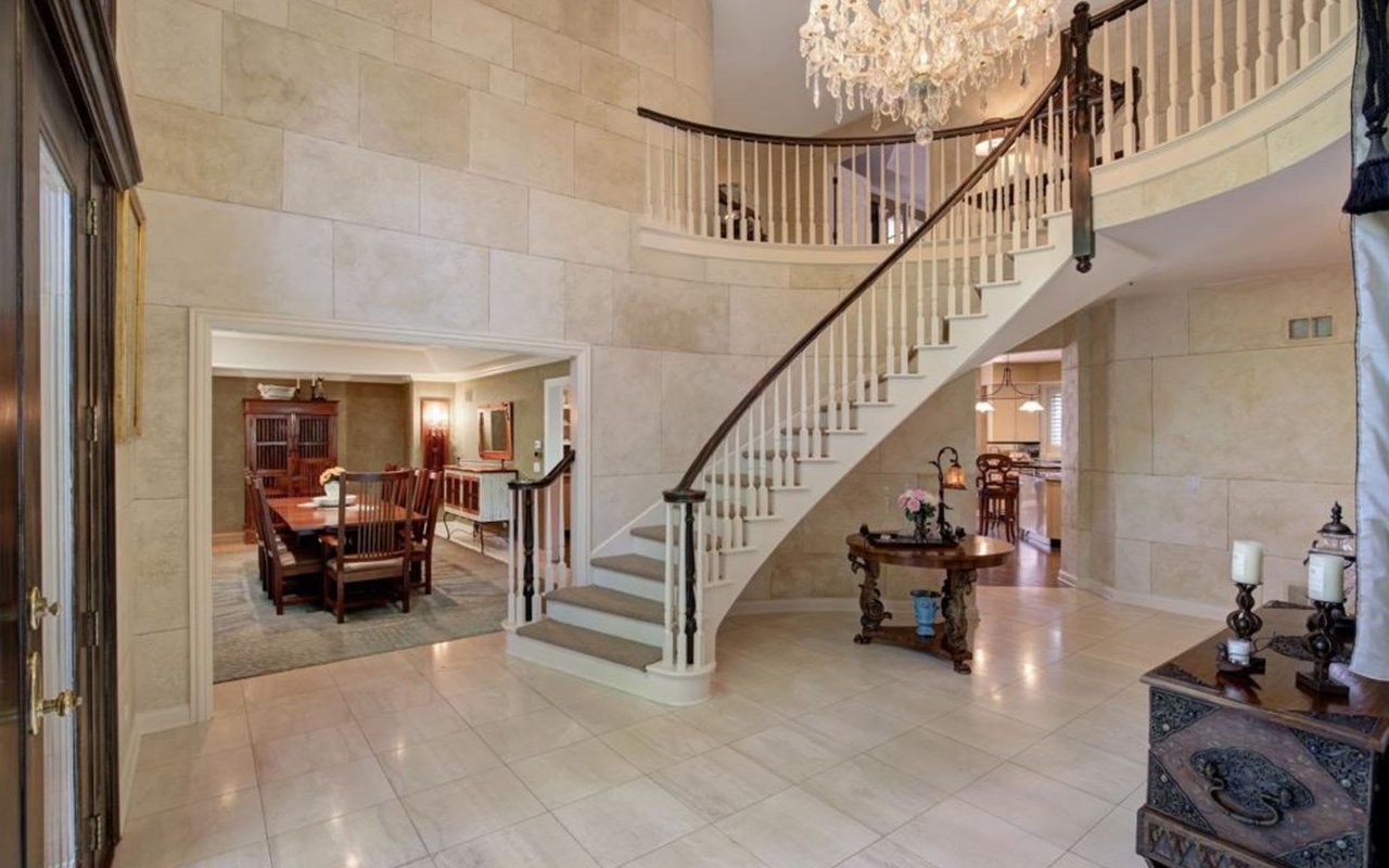 This Stately Brick Traditional Home Is Uniquely Positioned On One Of The Most Private Lots In Royal Melbourne