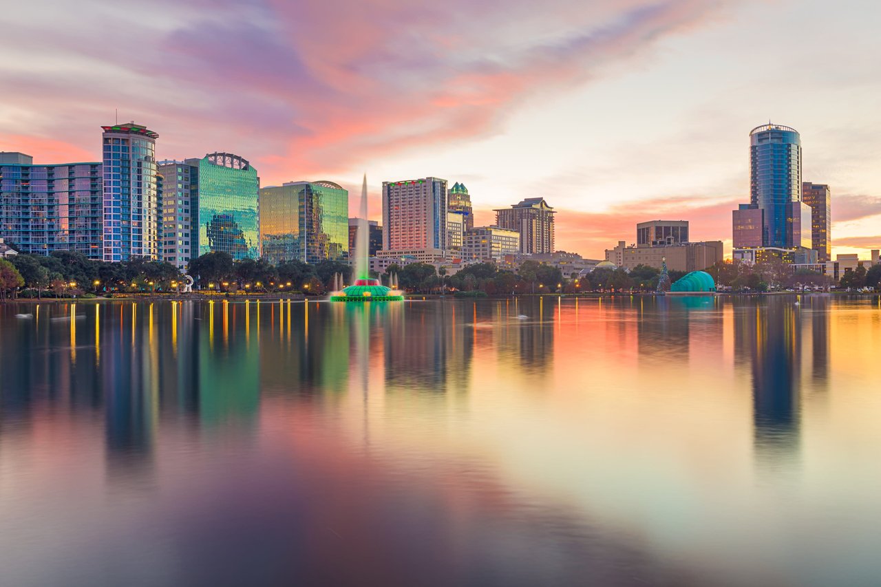 Beautiful sunset reflecting on Lake Eola at downtown Orlando, Florida