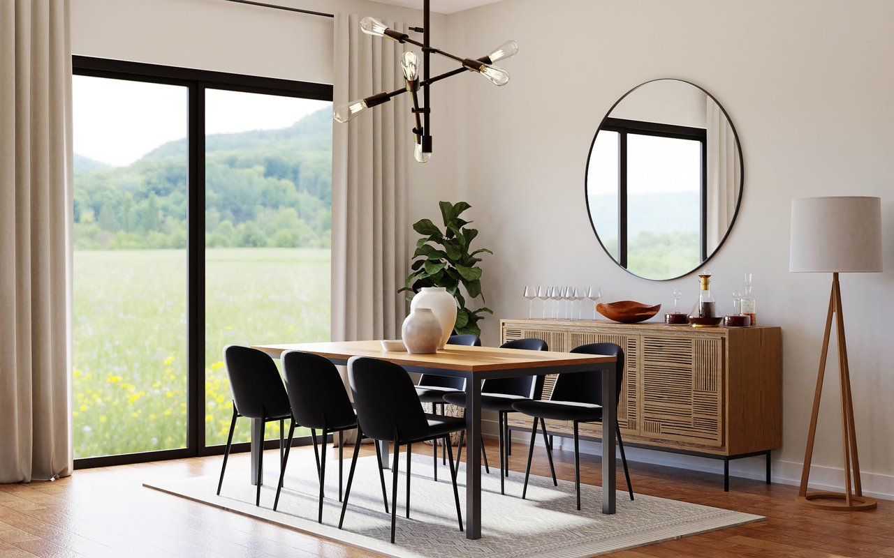 A modern home featuring dining room with a table, chairs, a mirror, and a lamp.