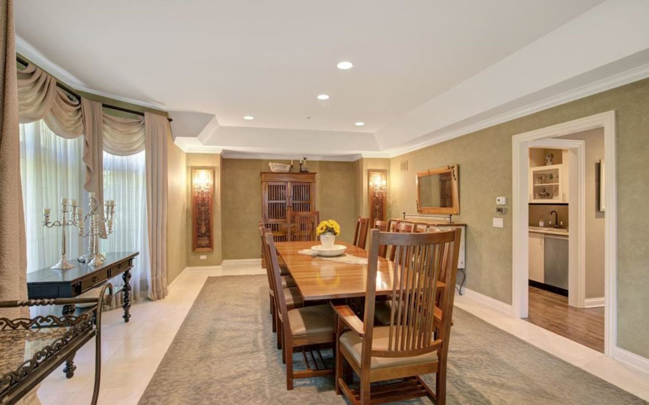 This Stately Brick Traditional Home Is Uniquely Positioned On One Of The Most Private Lots In Royal Melbourne