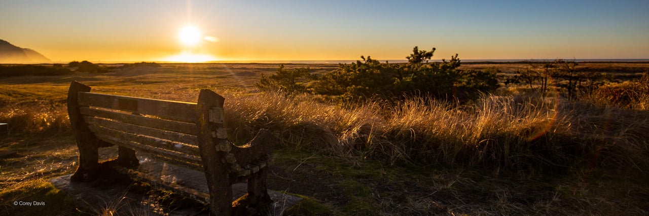 sunset in Gearhart Oregon overlooking  a bench near the ocean