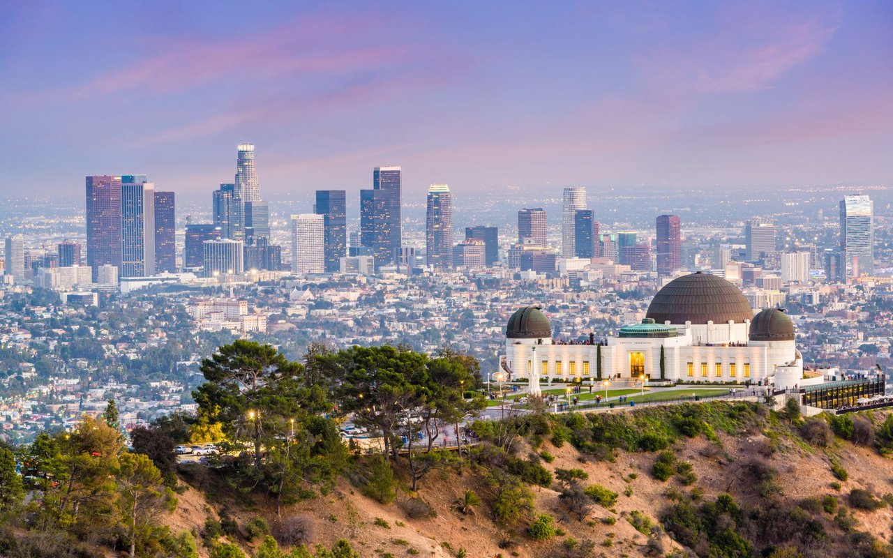 A panoramic view of the Los Angeles skyline at dusk.