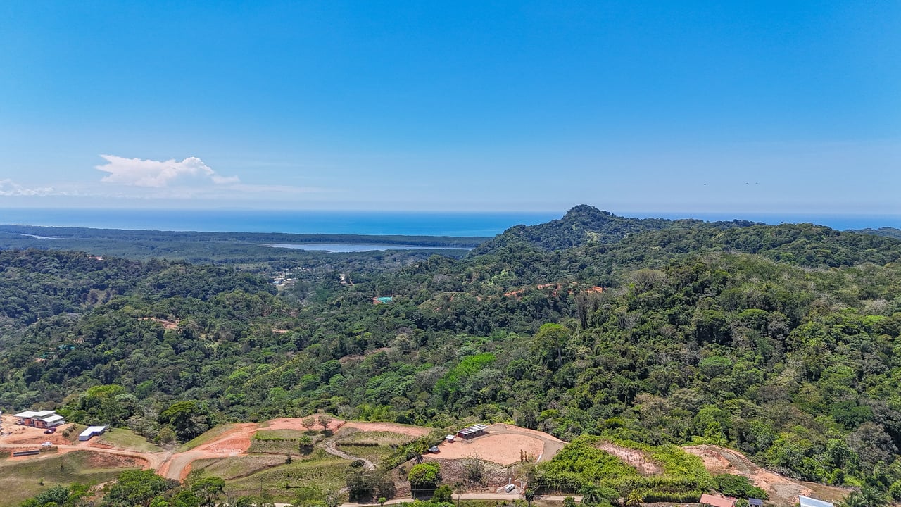 An elevated, prepared river lot with 360-degree ocean, mountain, valley and jungle views