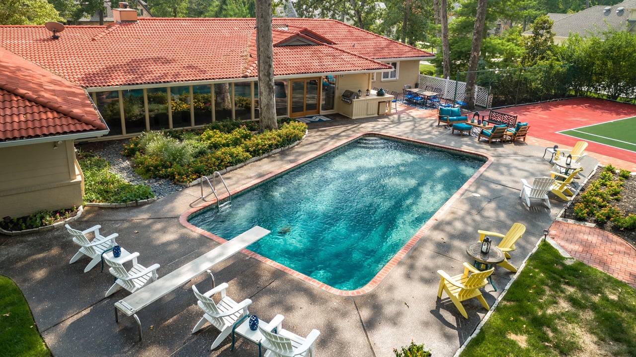 A Special Retreat on a Prized One Acre Lot With Pool and Tennis Court