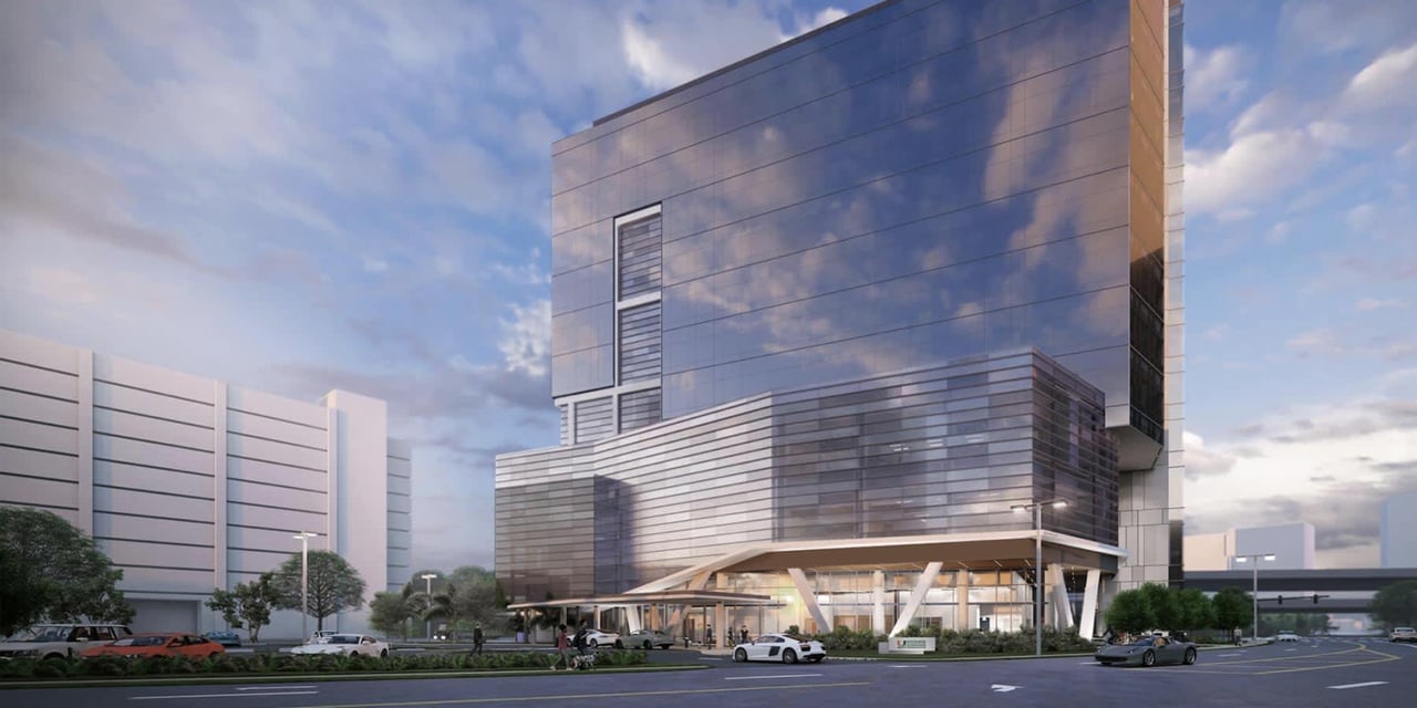 July 2024 - Glass Installation Underway at UM Cancer Center Being Built in Health District