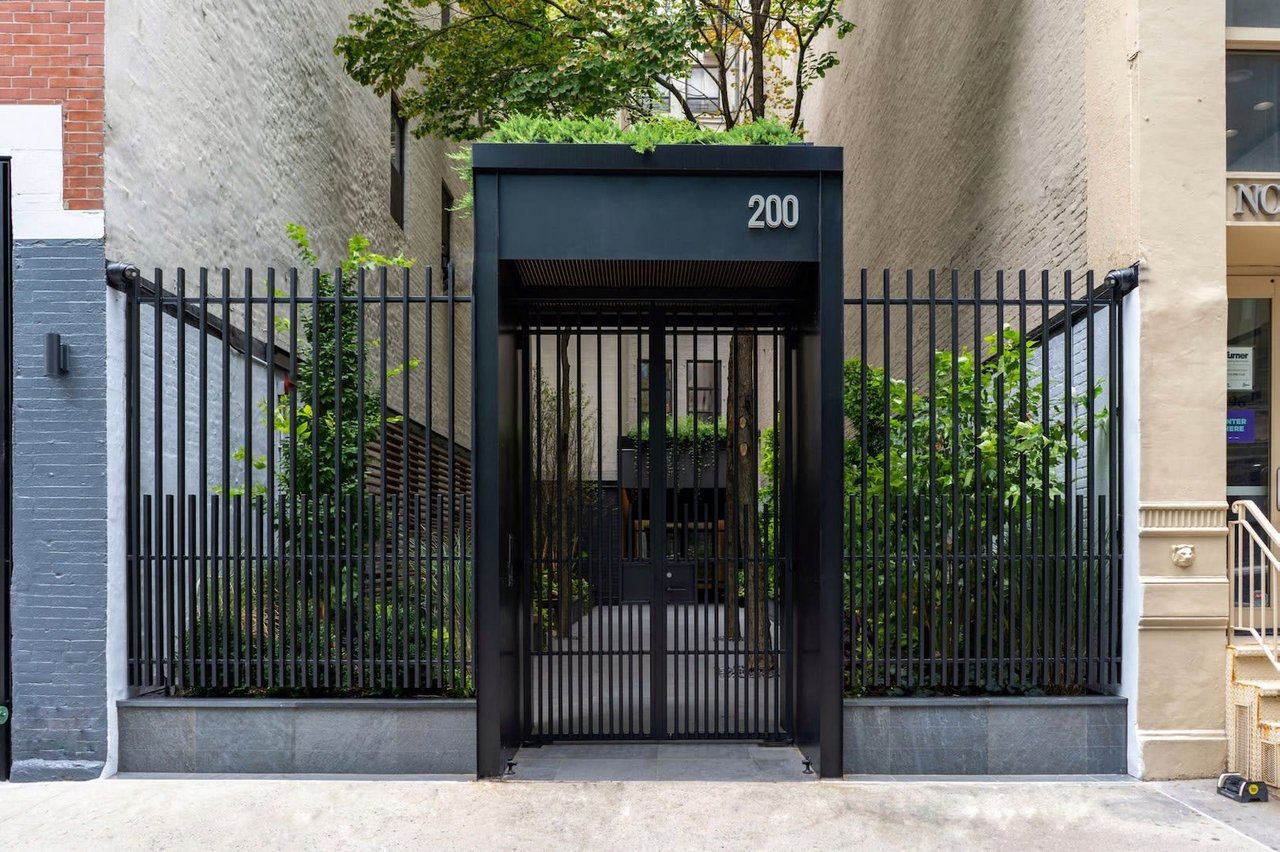 Gated, landscaped entrance at 200 Mercer Street, with the number 200 above the gate.
