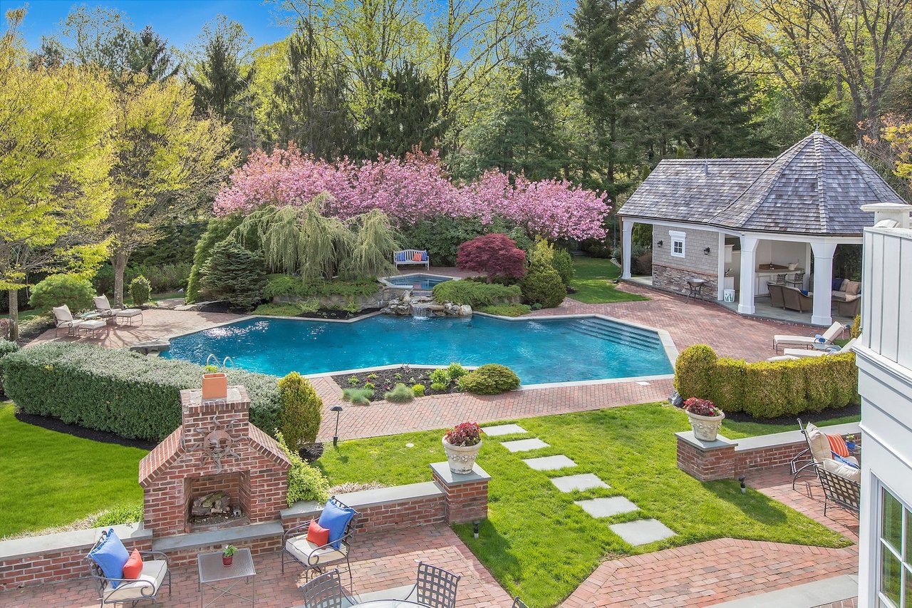 $8.75m Long Island Mansion Comes With a Go-kart Track, Beach Volleyball Court, Pool Waterfall, and More