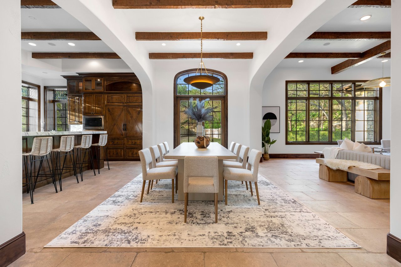 Spacious dining room at Elite Austin, featuring a white and clean dining table, exuding elegance and sophistication