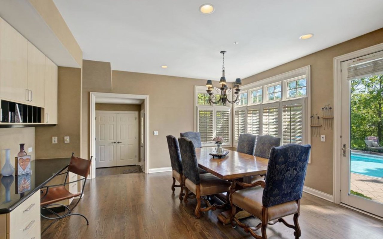 This Stately Brick Traditional Home Is Uniquely Positioned On One Of The Most Private Lots In Royal Melbourne