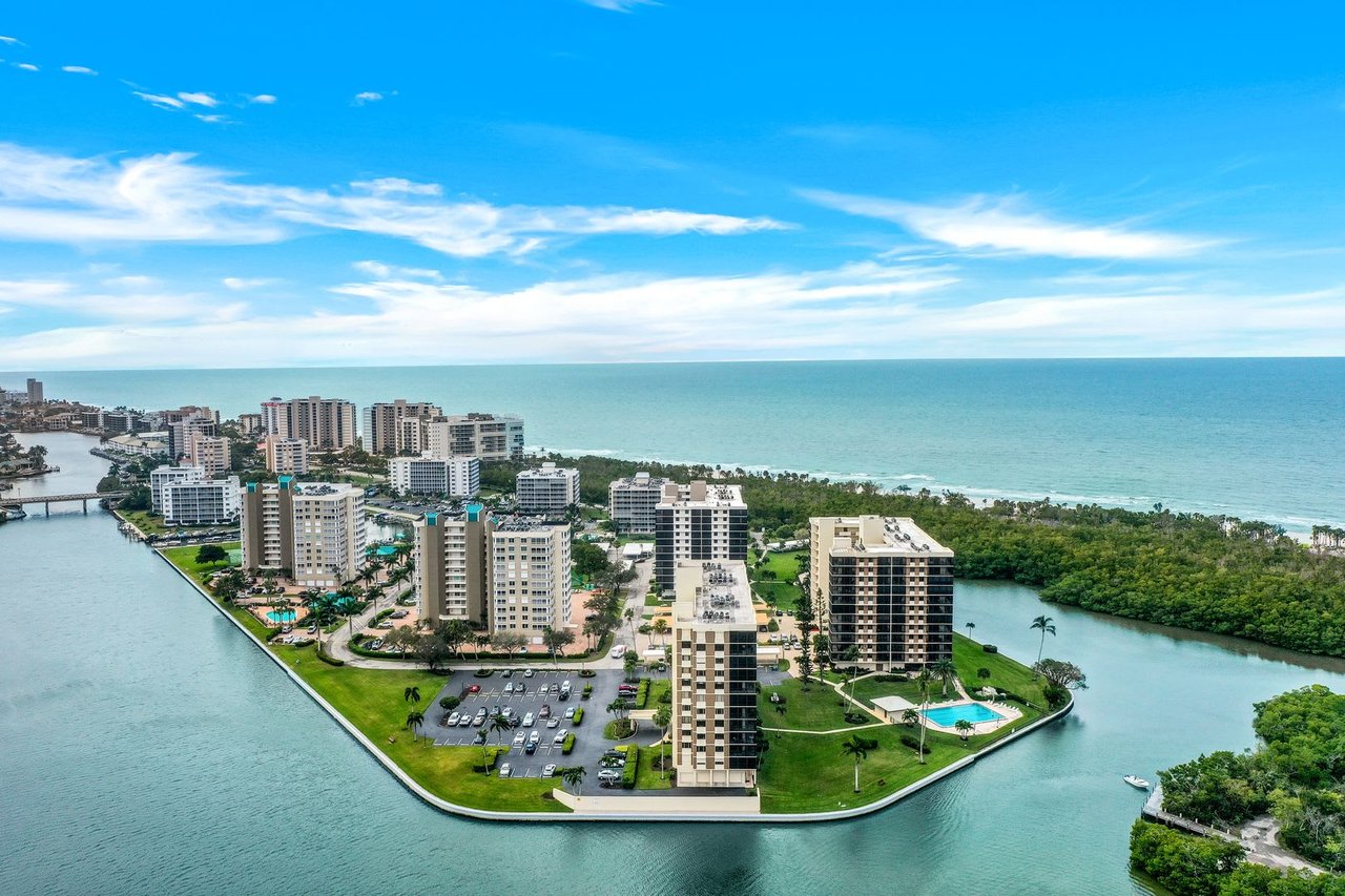  An aerial view shows a collection of high-rise buildings and condominiums.