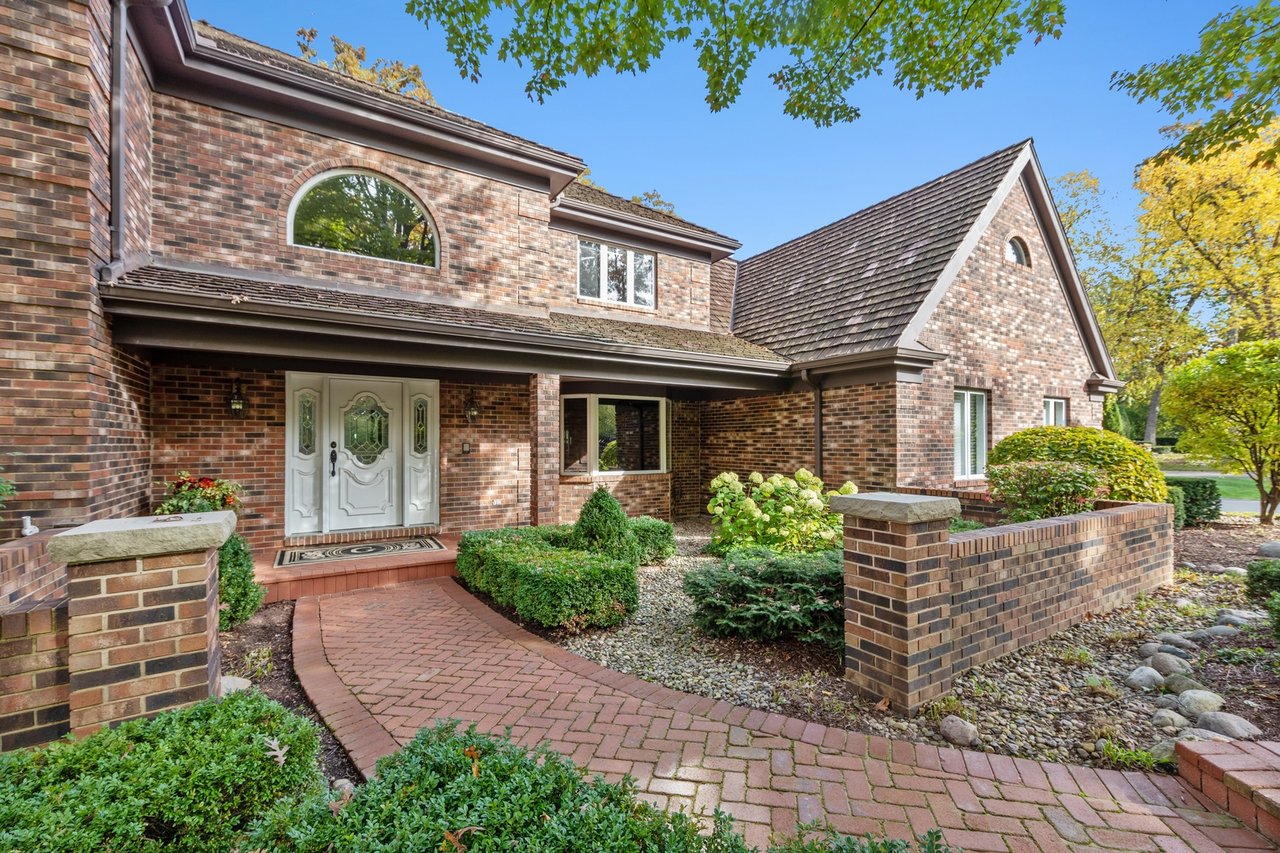 Beautifully Appointed Home in a Gated Community on Over an Acre of Professionally Landscaped Grounds with Pond Views