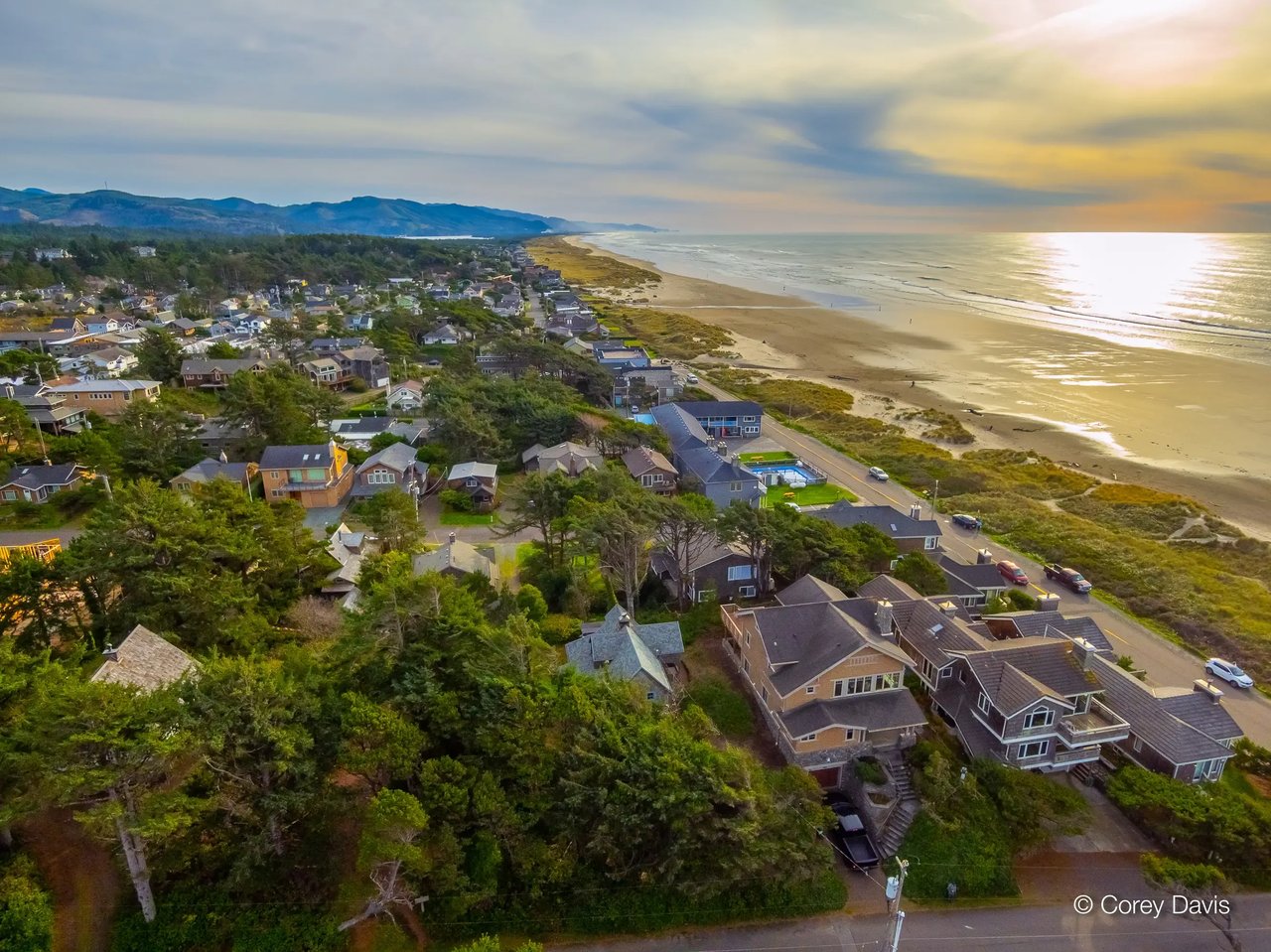 Silver yellow sunset aerial photograph of Manzanita oregon homes and the ocean