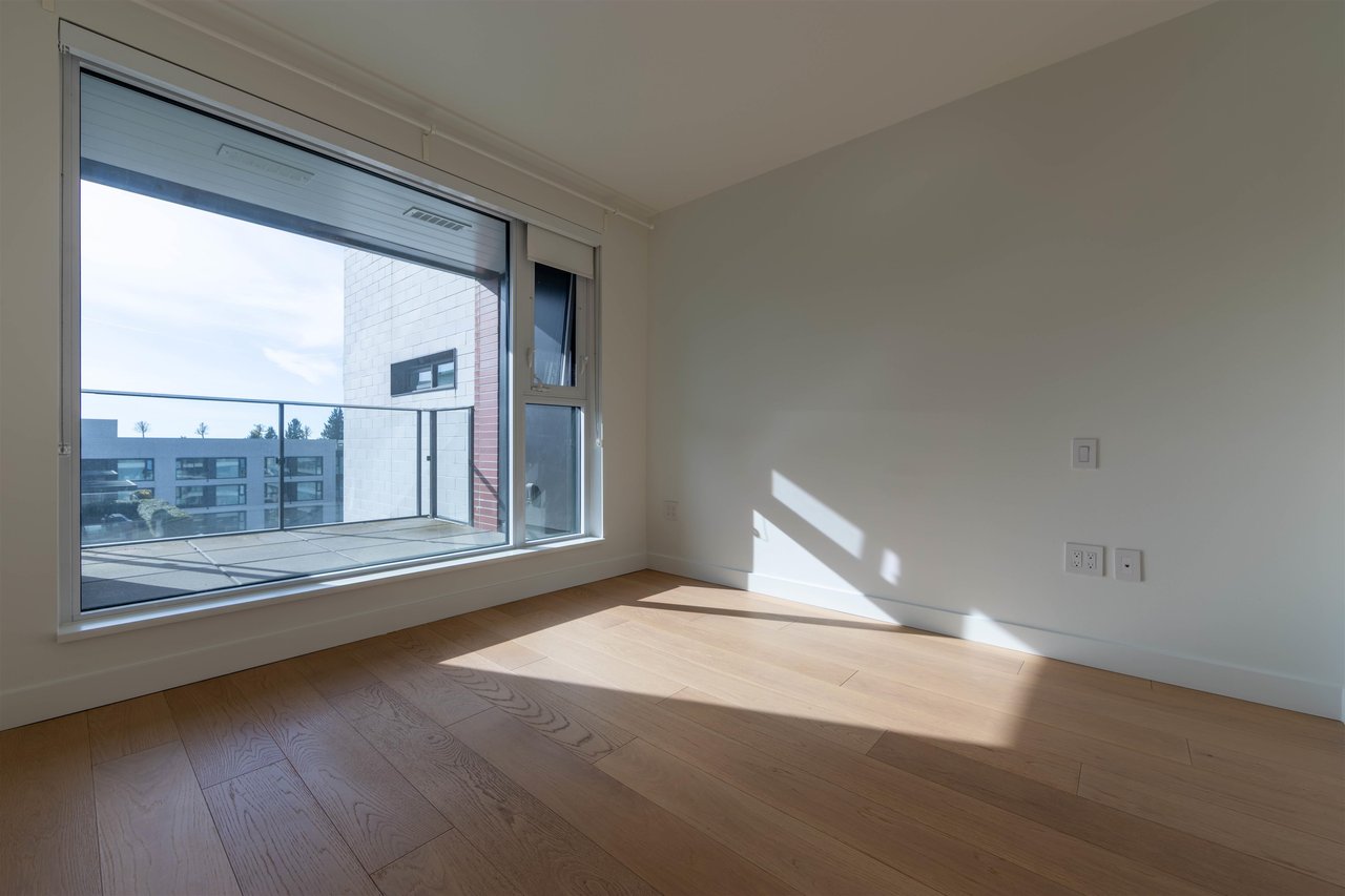 703-1561 W 57th Ave