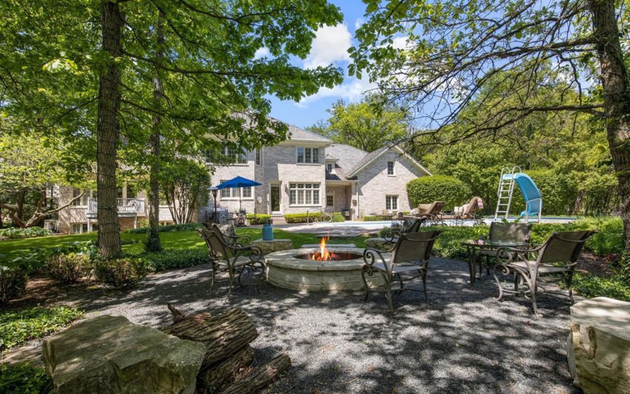 This Stately Brick Traditional Home Is Uniquely Positioned On One Of The Most Private Lots In Royal Melbourne